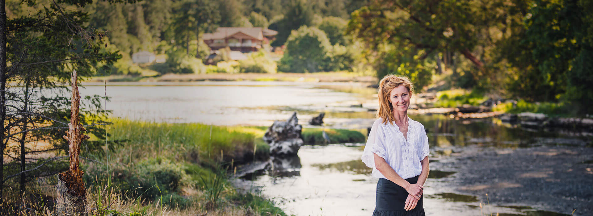stacey in front of a river